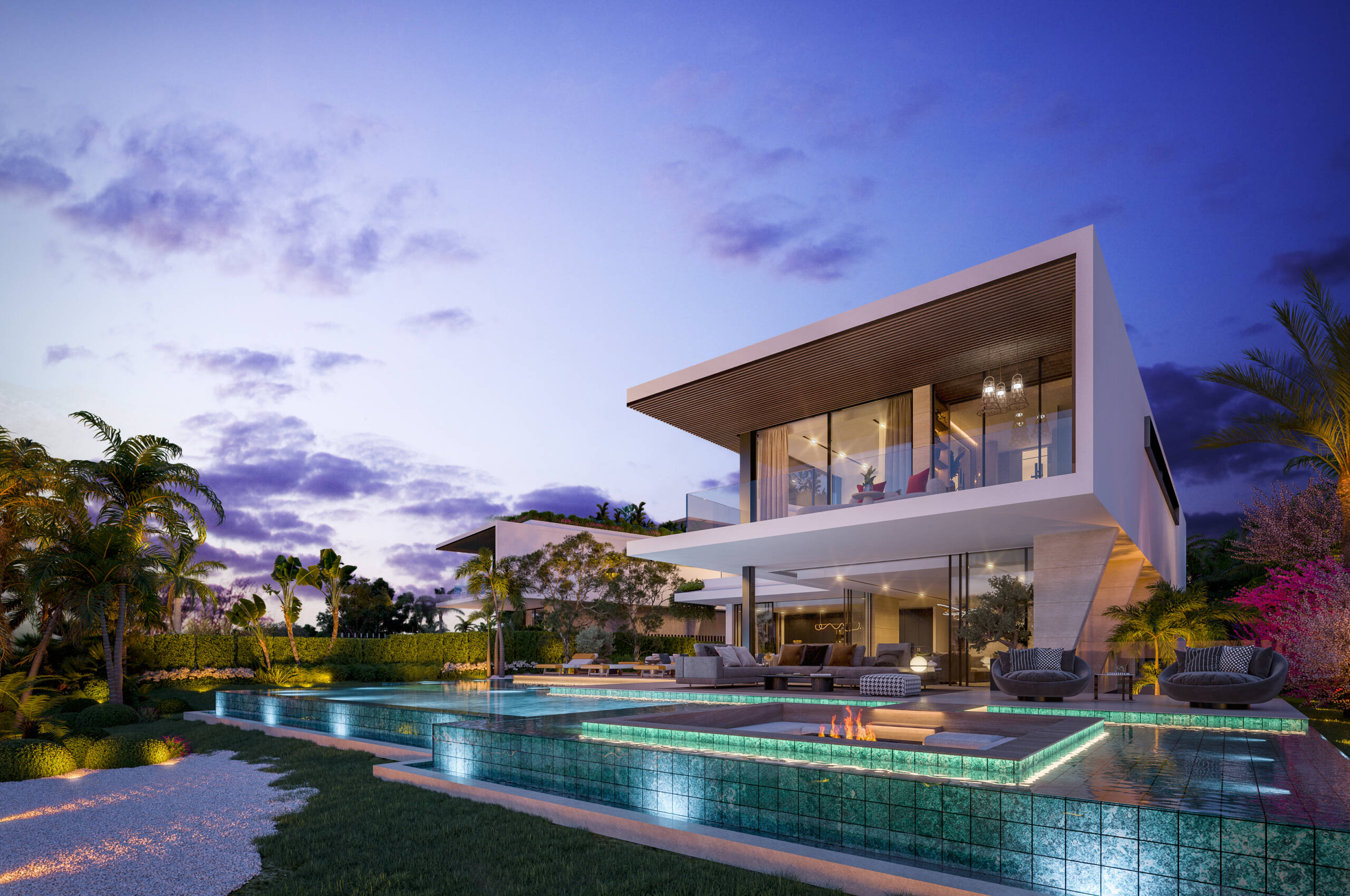 Paisaje nocturno de la facha de la vivienda, con la piscina iluminada